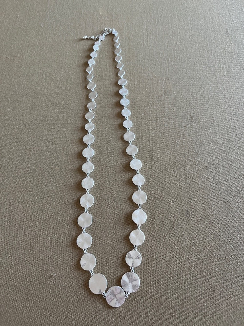 Unbranded silver tone hammered metal circles long necklace.
